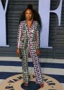 <p>The queen of Wakanda rocked a top knot and a bold printed suit. (Photo: JEAN-BAPTISTE LACROIX/AFP/Getty Images) </p>