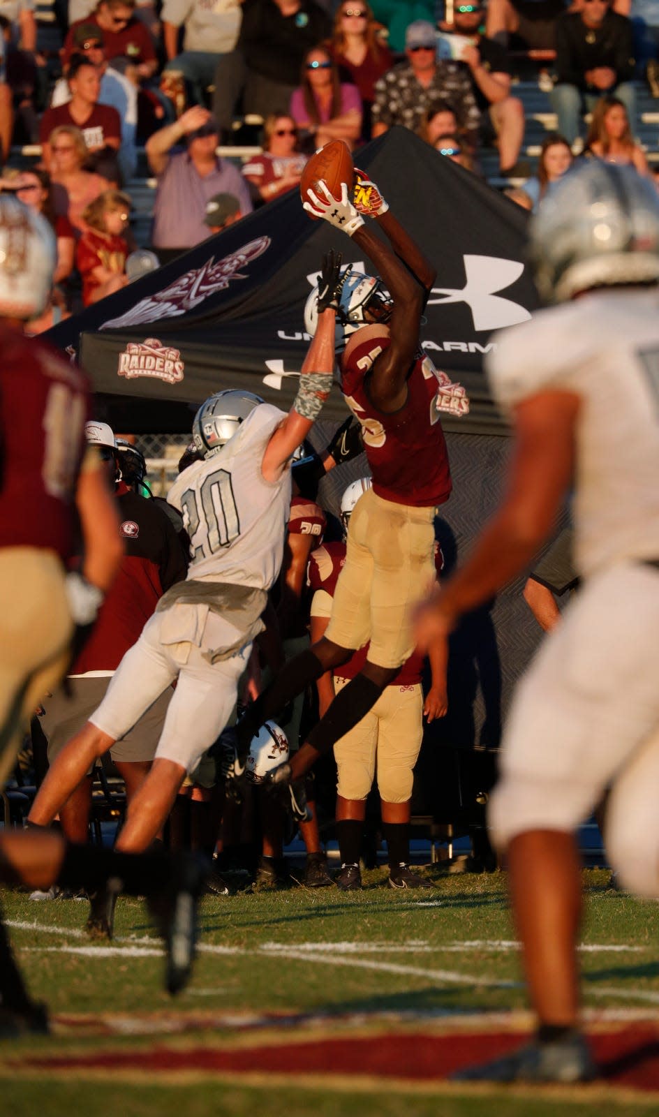 Riverdale's Jaheim Clarke goes up for a catch against Mariner defender Jacob Manning. Riverdale hosted Mariner in a high school football matchup Monday, Sept. 27, 2021.