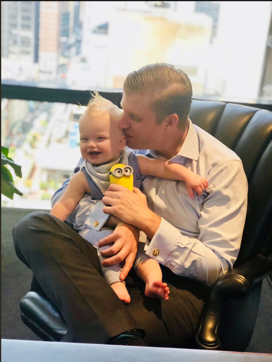 Eric Trump poses with his son, Luke, and a Minion toy, at his Trump Organization office in New York City. (Photo: Twitter/@EricTrump)