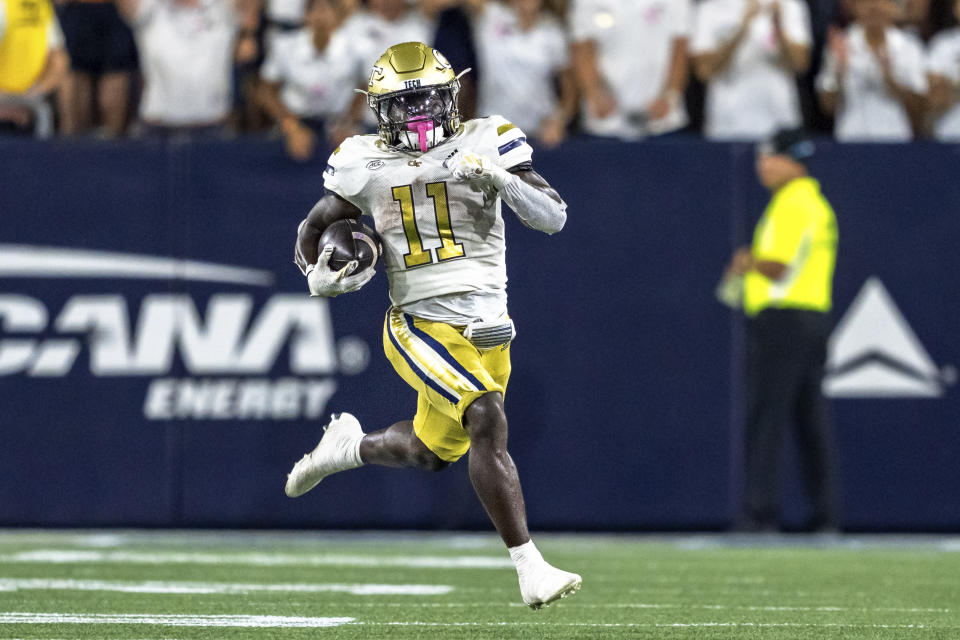 Georgia Tech running back Jamal Haynes (11) runs the ball in the first quarter of a football game against the Duke, during an NCAA college football game, Saturday, Oct. 5, 2024, in Atlanta. (AP Photo/Jason Allen)