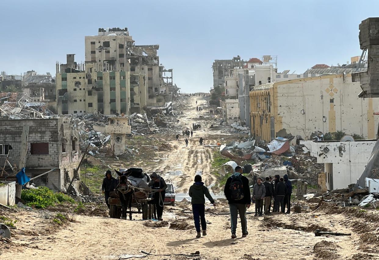 A view of destroyed buildings and roads is shown in Khan Yunis, Gaza, on Feb. 2, 2024. <a href="https://www.gettyimages.com/detail/news-photo/view-of-destruction-with-destroyed-buildings-and-roads-news-photo/1973206078?adppopup=true" rel="nofollow noopener" target="_blank" data-ylk="slk:Abdulqader Sabbah/Anadolu via Getty Images;elm:context_link;itc:0;sec:content-canvas" class="link ">Abdulqader Sabbah/Anadolu via Getty Images </a>