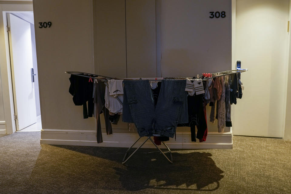 Laundry of Israelis evacuated from Kiryat Shmona, hangs in the hallway between two rooms at the hotel in Tiberias, northern Israel, Monday, March 4, 2024. Around 60,000 Israelis who evacuated from cities and towns along the border with Lebanon are grappling with the question of when they will be able to return home. Hezbollah began launching rockets towards Israel one day after Hamas-led militants stormed into southern Israel on Oct. 7. (AP Photo/Ariel Schalit)