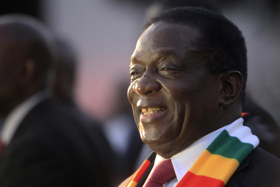 Zimbabwean President elect Emmerson Mnangagwa smiles after addressing a press conference in Harare ,Friday, Aug, 3, 2018. Zimbabwe's president says people are free to approach the courts if they have issues with the results of Monday's election, which he carried with just over 50 percent of the vote. President Emmerson Mnangagwa spoke to journalists shortly after opposition leader Nelson Chamisa called the election results manipulated and said they would be challenged in court. (AP Photo/Tsvangirayi Mukwazhi)