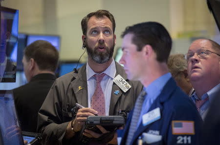 Traders work on the floor of the New York Stock Exchange April 30, 2015. REUTERS/Brendan McDermid