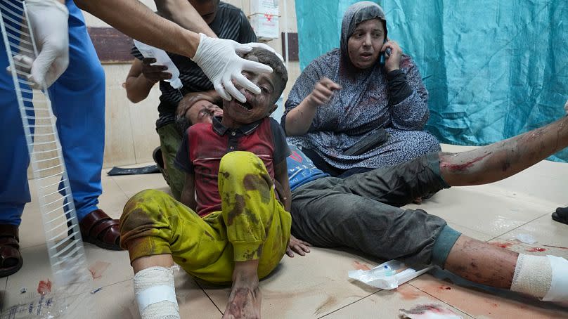 Palestinians wounded in an Israeli bombardment wait for treatment in a hospital in Deir al-Balah, south of the Gaza Strip, Tuesday, Oct. 24, 2023.