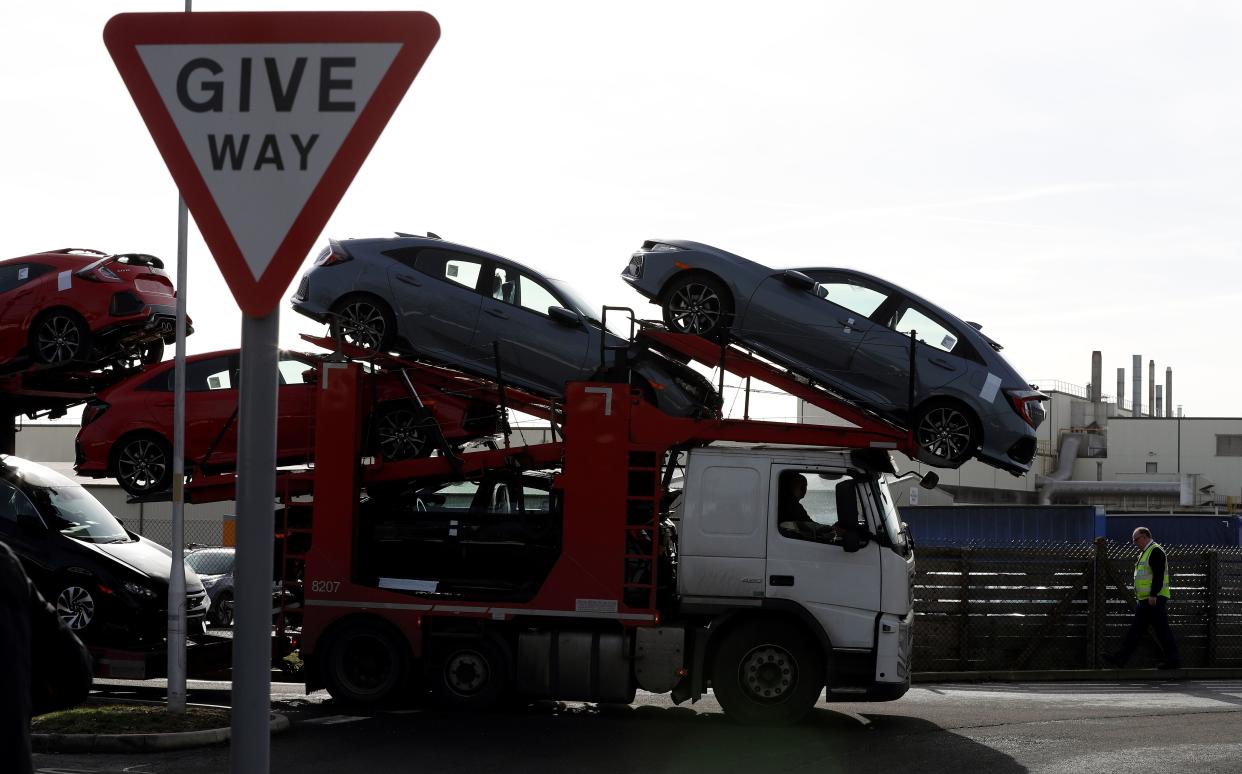 A car transporter loaded with new Honda vehicles is driven out of the Honda manufacturing plant in Swindon, southwest England on February 19, 2019. - Honda announced Tuesday it would shut a major plant in Britain, putting 3,500 jobs at risk as the auto manufacturer became the latest Japanese firm to downsize operations as Brexit looms. The factory in Swindon, southwest England, is Honda's only EU plant and has produced the manufacturer's "Civic" model for more than 24 years, with 150,000 units rolling off the line annually. (Photo by Adrian DENNIS / AFP)        (Photo credit should read ADRIAN DENNIS/AFP/Getty Images)