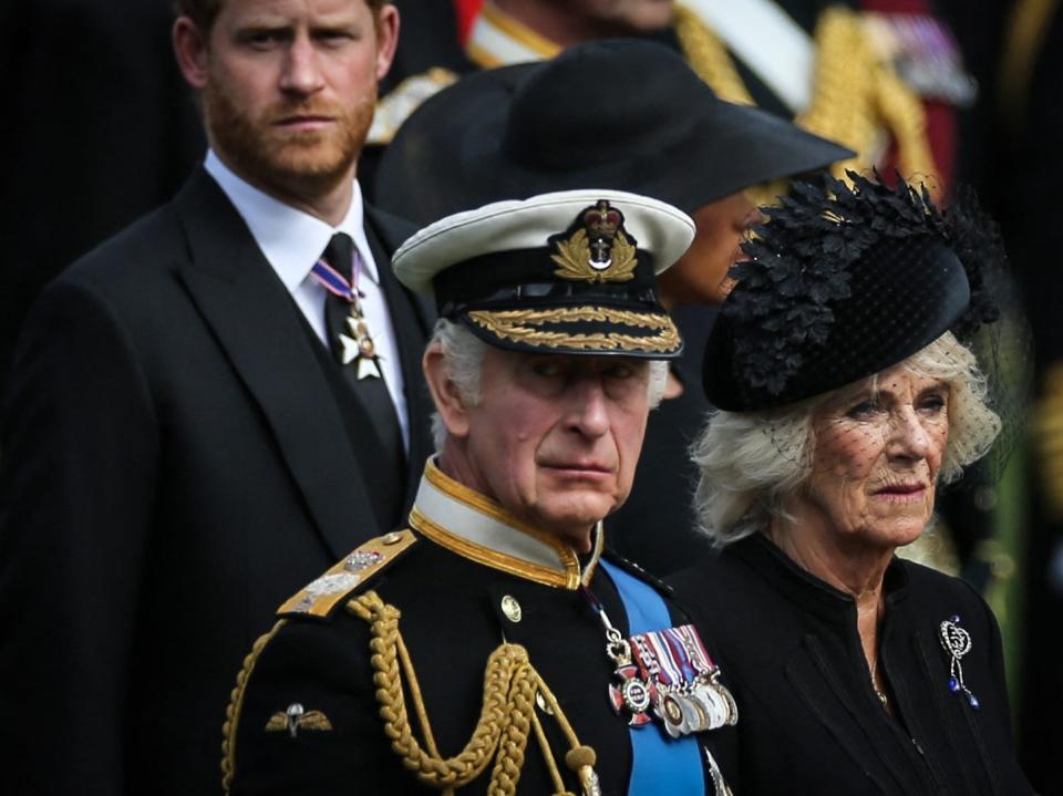 Britain's King Charles III (L), Britain's Camilla, Queen Consort and Britain's Prince Harry, Duke of Sussex