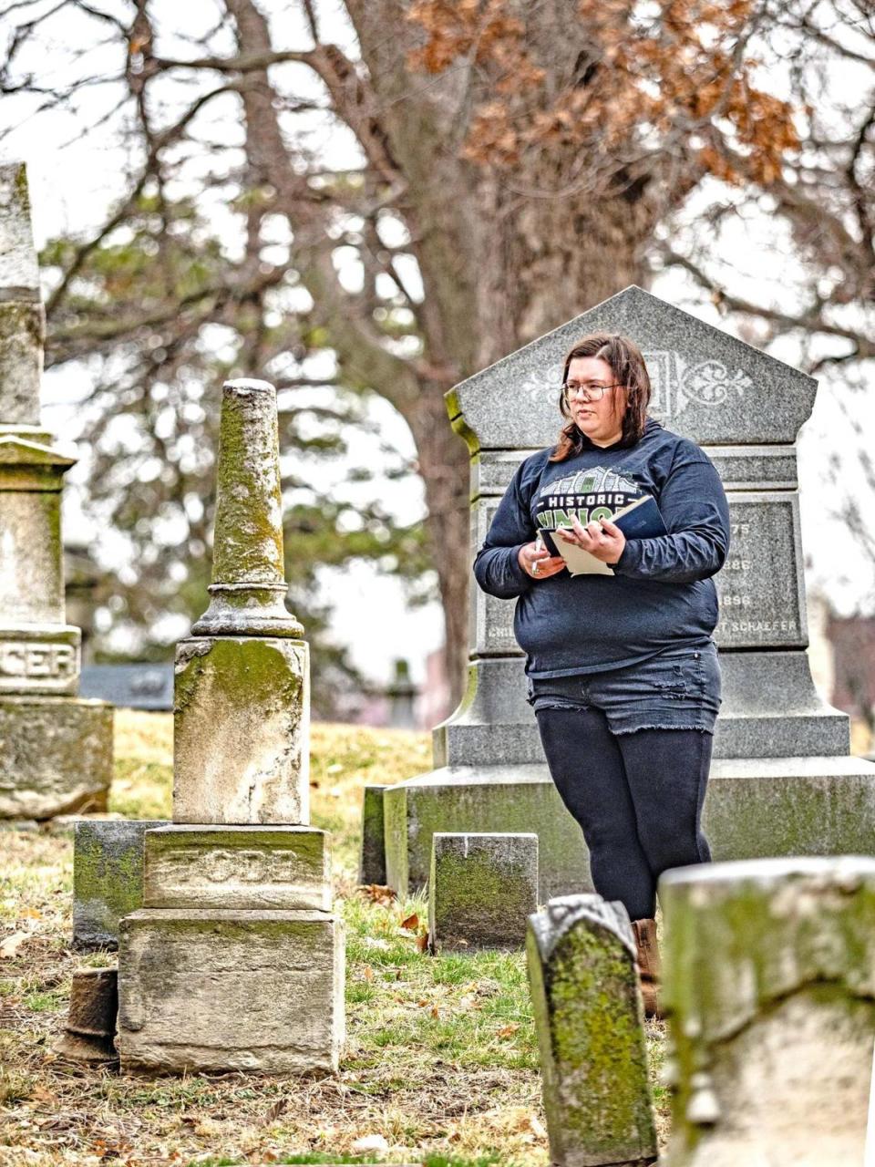Heather Faries, vice president of the Union Cemetery Historical Society, checks the condition of gravestones. Founded in 1857, Union Cemetery is Kansas City’s oldest public graveyard.
