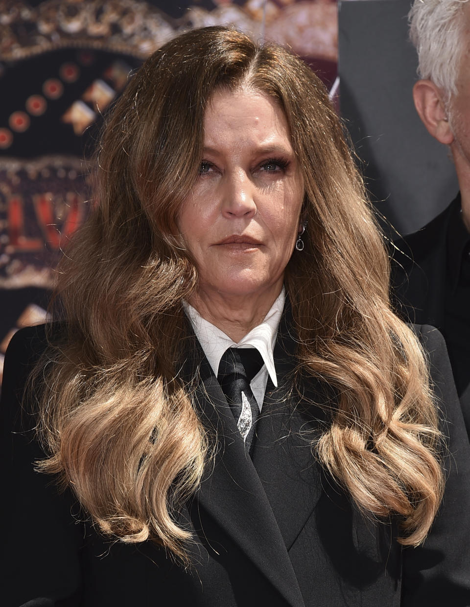 FILE - Lisa Marie Presley, daughter of the late singer Elvis Presley, poses during a handprint ceremony honoring the Presley family on June 21, 2022, at the TCL Chinese Theatre in Los Angeles. Lisa Marie Presley, singer and only child of Elvis, died Thursday, Jan. 12, 2023, after a hospitalization, according to her mother, Priscilla Presley. She was 54. (Photo by Jordan Strauss/Invision/AP, File)