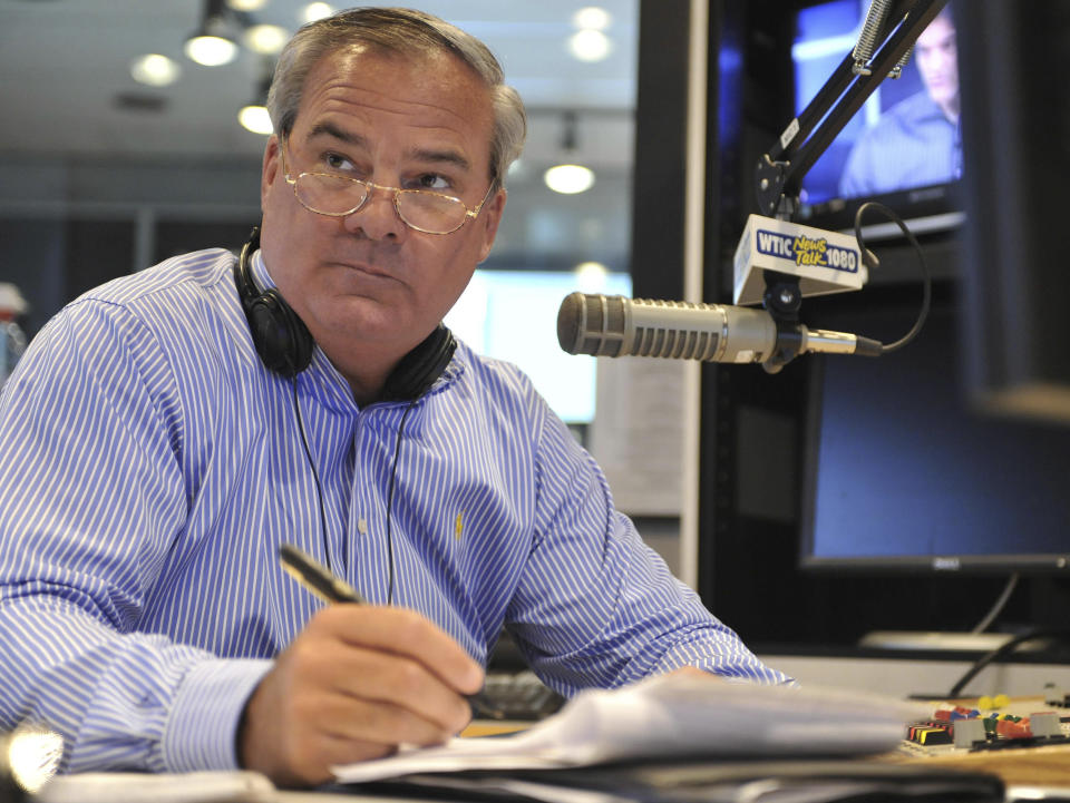 FILE - In this July 2, 2010 file photo, former Connecticut Gov. John Rowland sits in studio as a talk show host on WTIC AM radio in Farmington, Conn. Rowland resigned from office in 2004 amid a corruption scandal. He eventually was sentenced to serve time in a federal prison, but again is in the crosshairs of federal investigators. On Monday, March 31, 2014, a former Republican Congressional candidate and her husband pleaded guilty in a scheme to create a phony contract to hide the consulting role Rowland played in her campaign. (AP Photo/Jessica Hill, File)