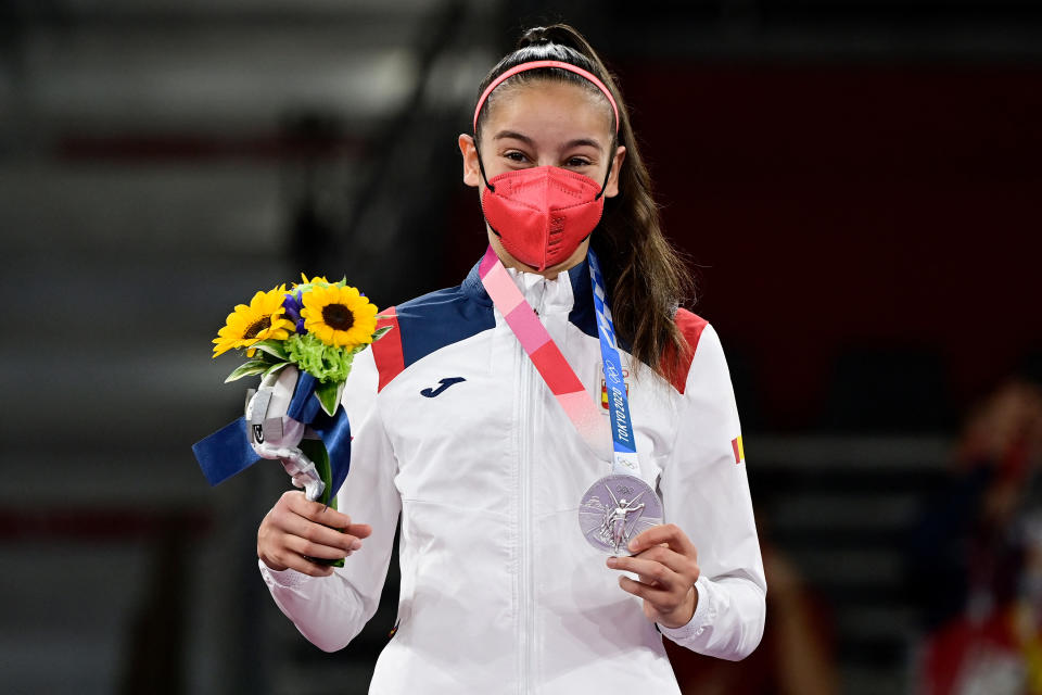 Spain's Adriana Cerezo Iglesias celebrates with her silver medal on the podium after winning the taekwondo women's -49kg gold medal bout during the Tokyo 2020 Olympic Games at the Makuhari Messe Hall in Tokyo on July 24, 2021. (Photo by Javier SORIANO / AFP) (Photo by JAVIER SORIANO/AFP via Getty Images)