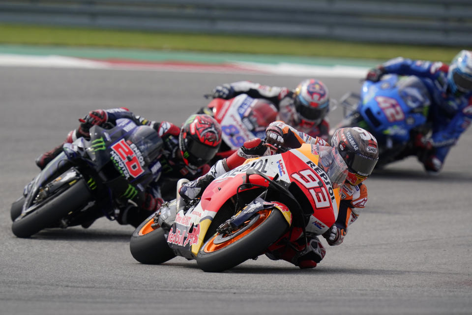 Spain's Marc Marquez (93) steers through a turn ahead of Fabio Quartararo (20), of France, Jorge Martin (89), also of Spain, and Alex Rins (42), of Australia, during the MotoGP Grand Prix of the Americas motorcycle race at Circuit of the Americas, Sunday, Oct. 3, 2021, in Austin, Texas. (AP Photo/Eric Gay)