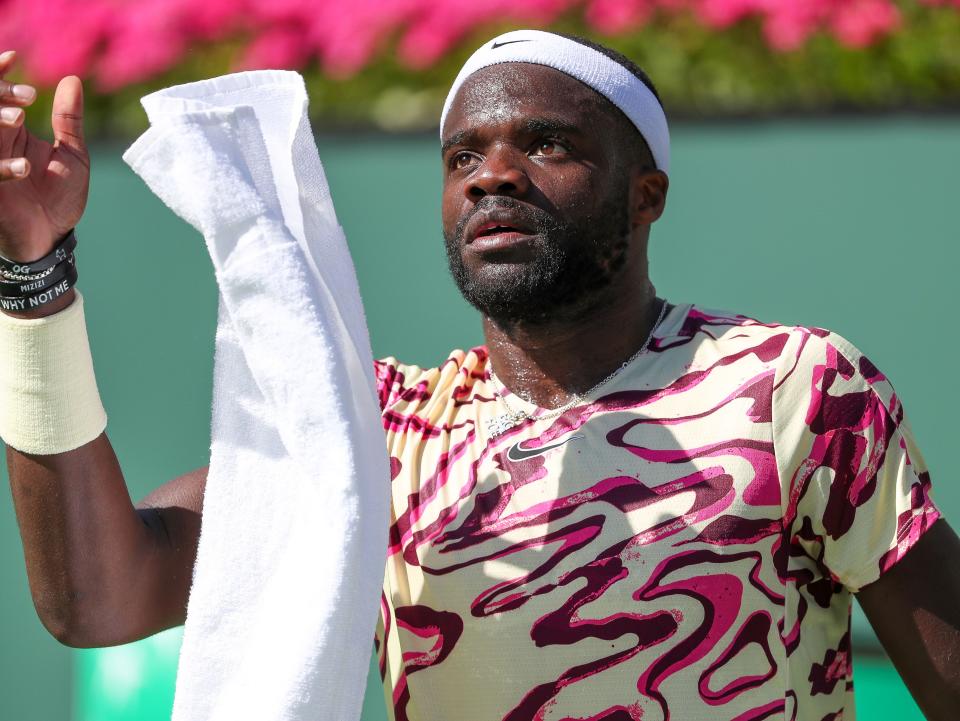 Francis Tiafoe grabs a towel in his semifinal loss to Daniil Medvedev during the BNP Paribas Open at the Indian Wells Tennis Garden in Indian Wells, Calif., March 18, 2023.