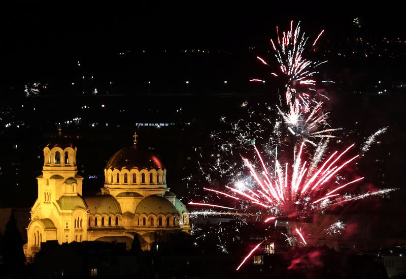 Fireworks explode over Alexander Nevski cathedral during the New Year celebrations in Sofia
