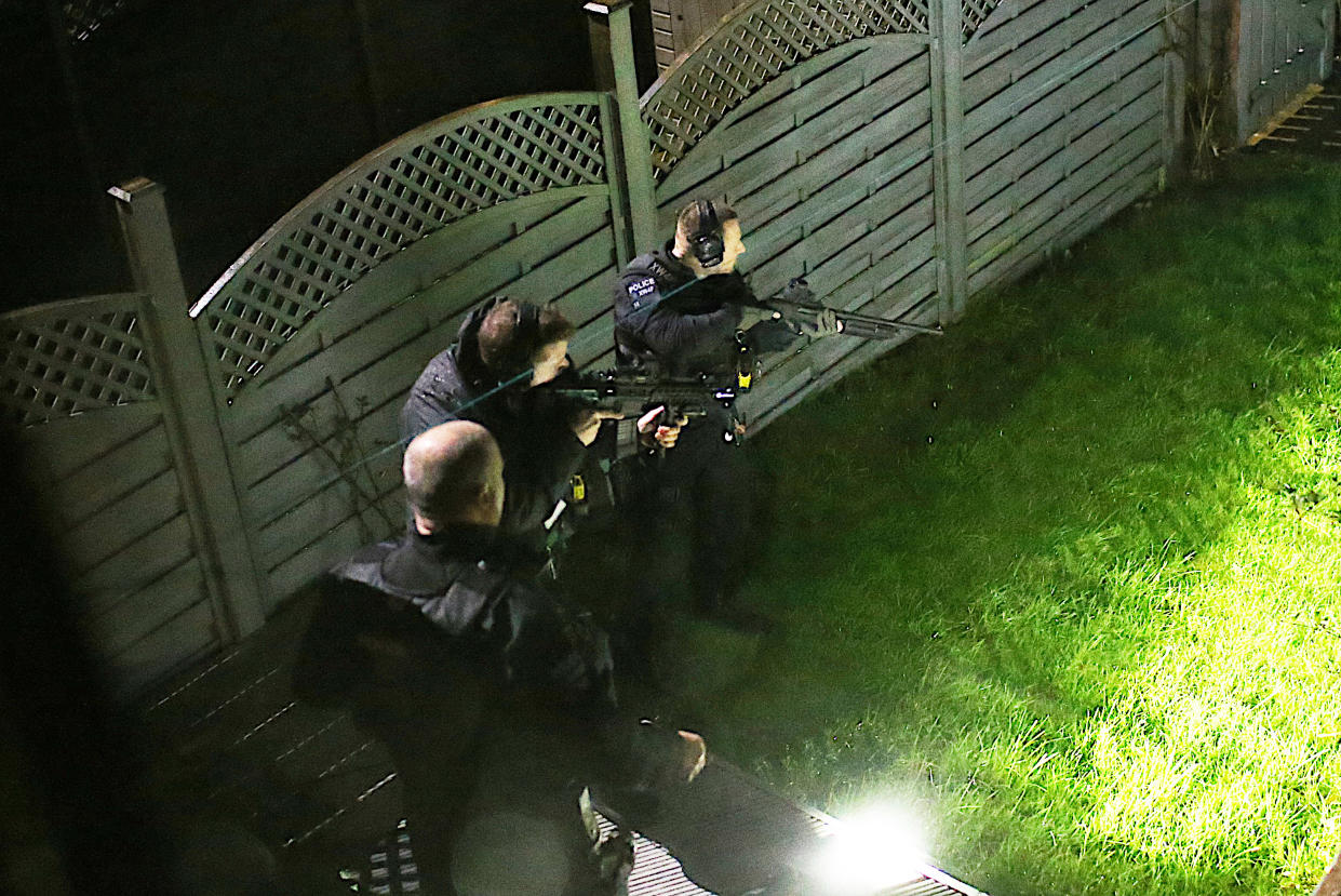 Armed police officers after they shot dead a dog believed to be an XL bully in Halifax. (SWNS)