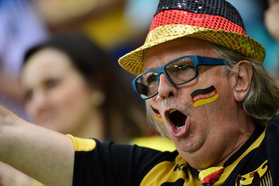 A German fan cheers his team prior to the men's preliminaries Group B handball match Sweden vs Germany for the Rio 2016 Olympics Games at the Future Arena in Rio on August 7, 2016.&nbsp;