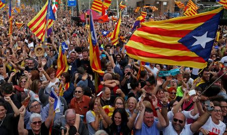 People celebrate after the Catalan regional parliament passes the vote of the independence from Spain in Barcelona, Spain October 27, 2017. REUTERS/Yves Herman