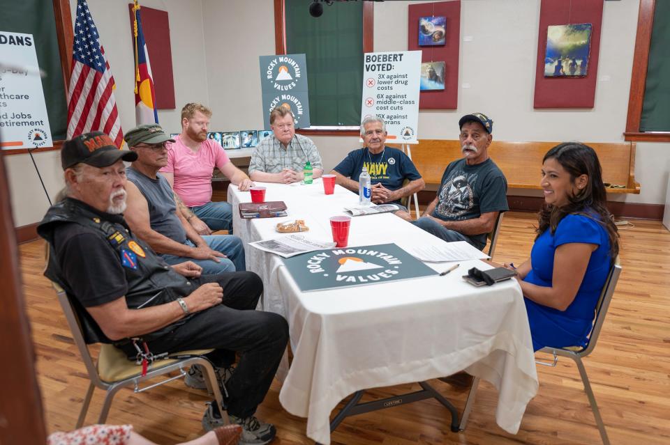 A group of military veterans speak with Sol Sandoval during a Rocky Mountain Values rountable discussion on the one year anniversary of the PACT Act being signed into law.