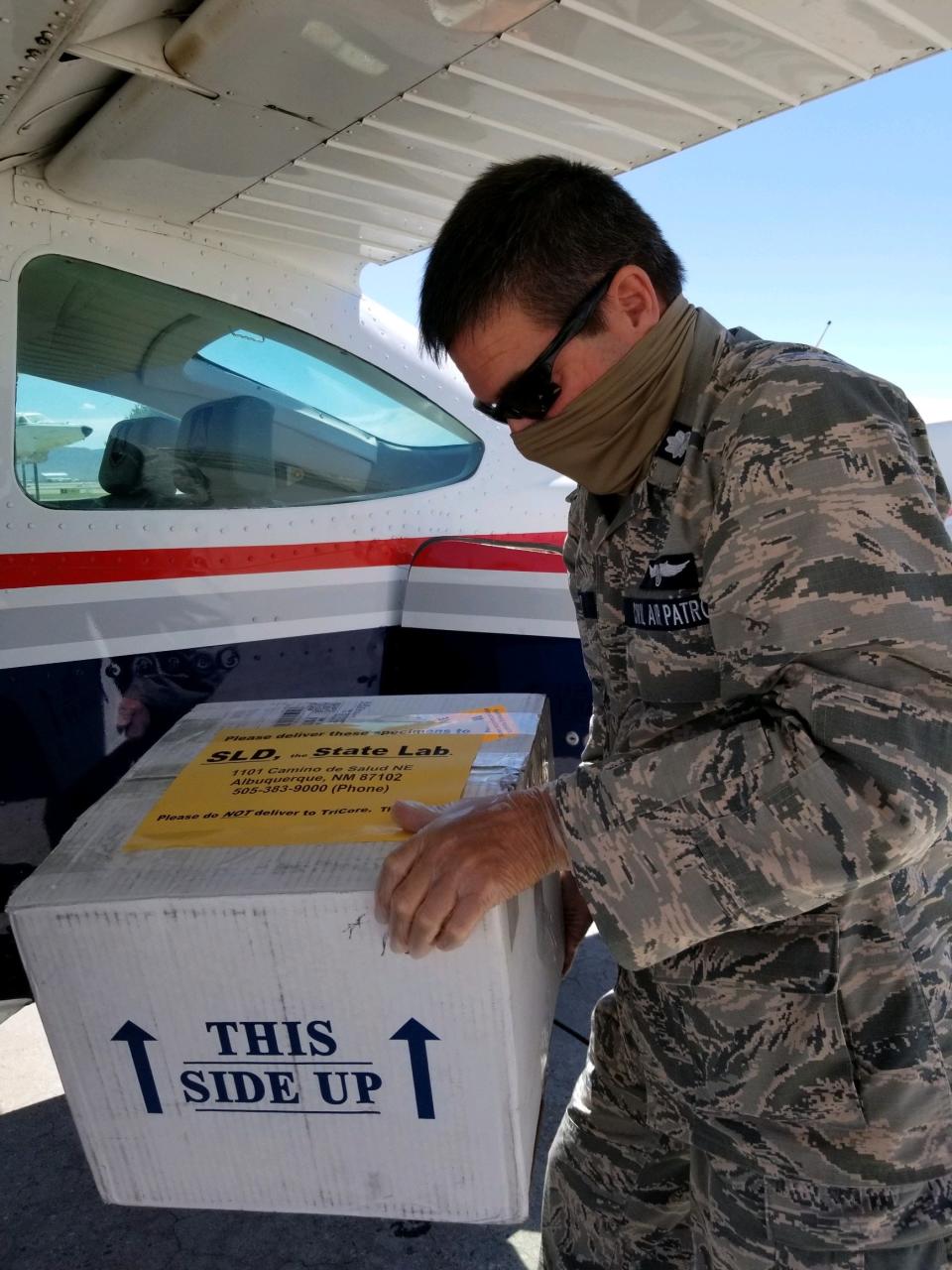 Assisting with transport of test kits to the State Lab during NMWG's support of Covid response operations