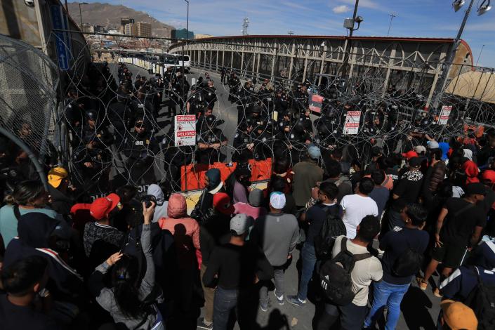 U.S. Customs and Border Protection officers guard the Paso Del Norte Bridge on March 12, 2023, after migrants walked onto the bridge wanting to enter the U.S. to seek asylum. 