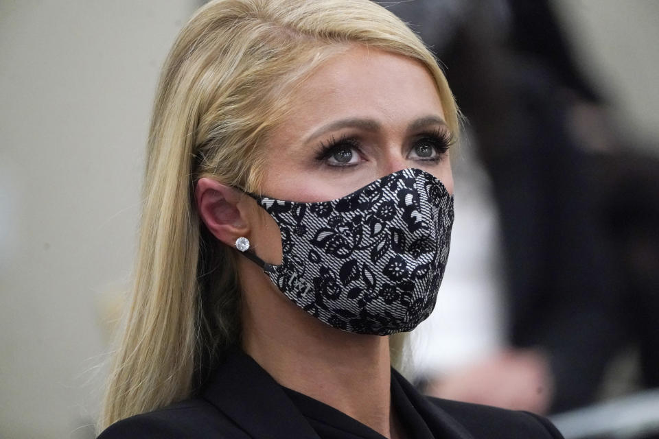 Paris Hilton looks on after speaking at a committee hearing at the Utah State Capitol, Monday, Feb. 8, 2021, in Salt Lake City. Hilton has been speaking out about abuse she says she suffered at a boarding school in Utah in the 1990s and she testified in front of state lawmakers weighing new regulations for the industry. (AP Photo/Rick Bowmer)