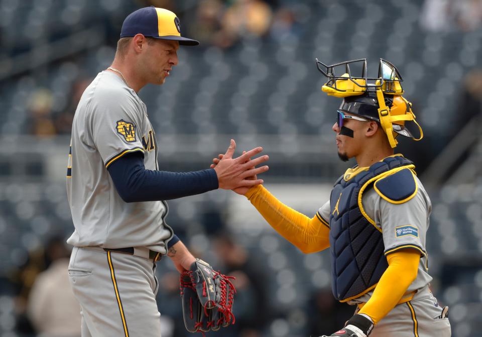 Brewers relief pitcher Trevor Megill, left, and catcher William Contreras shake hands after defeating the Pirates at PNC Park.