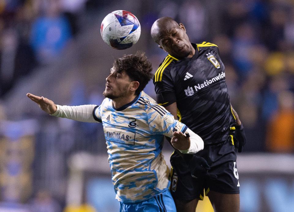 Union forward Julian Carranza and the Crew's Darlington Nagbe compete for a header.