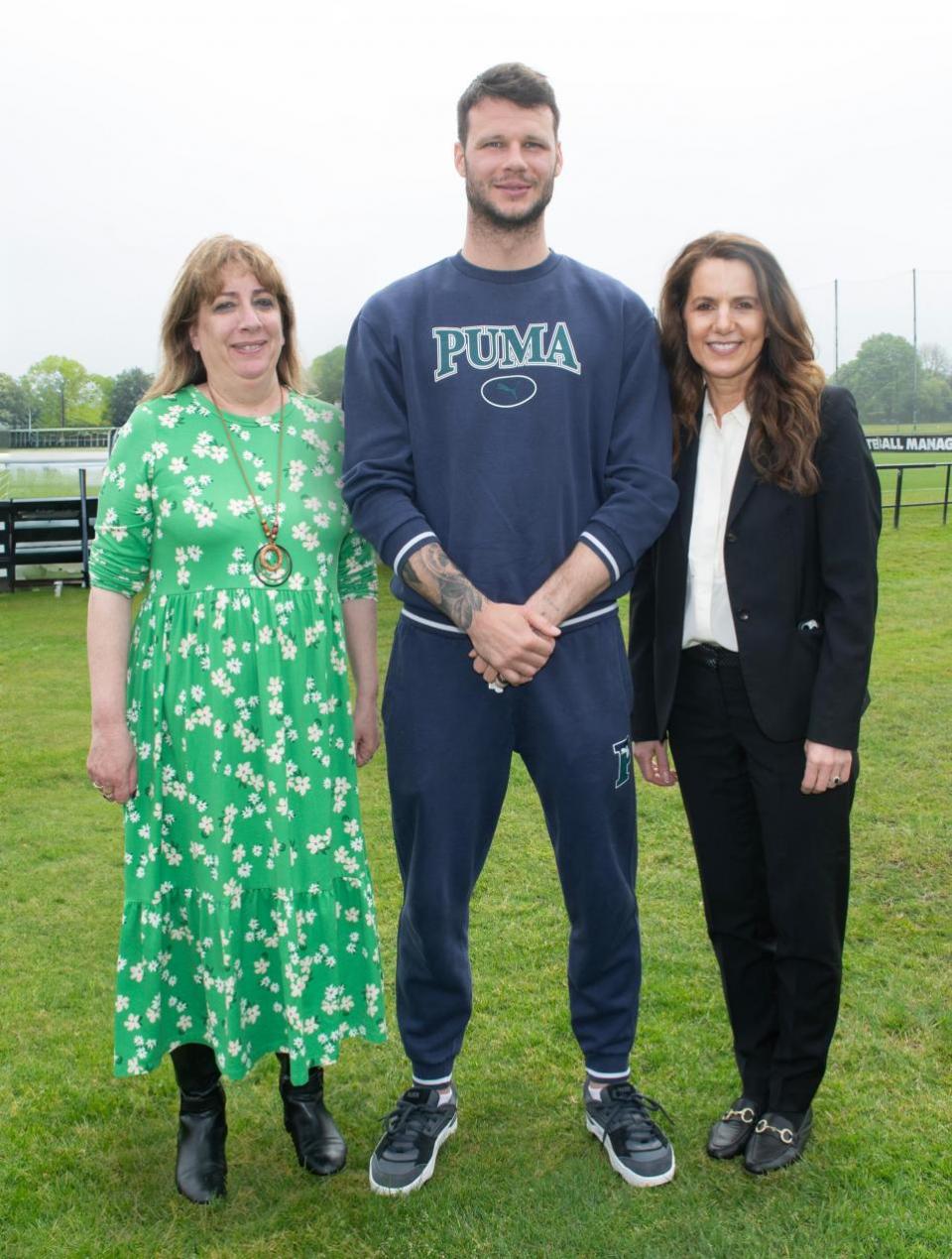 Watford Observer: Daniel Bachmann with CEO Alison Rosen, left, and Natalie Halliwell-Jennings from the charity
