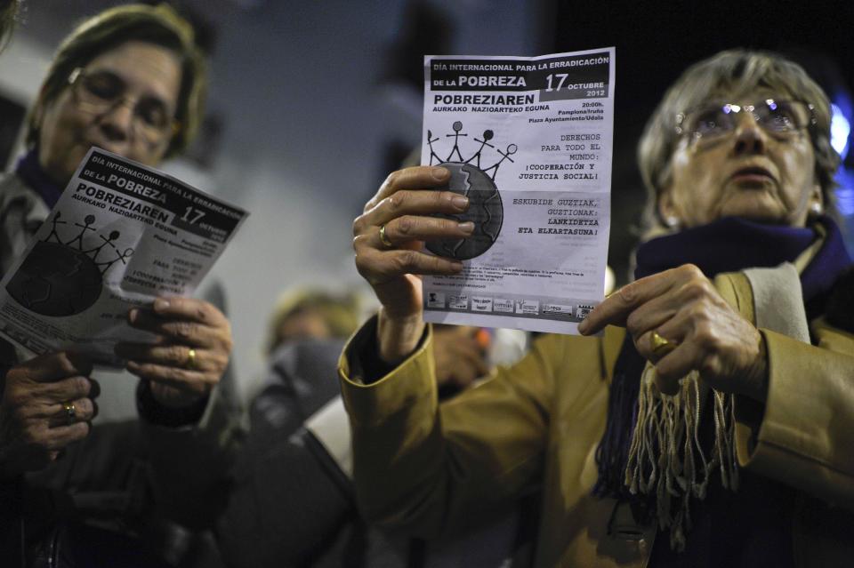 People mark a day against the poverty, in Pamplona, northern Spain, Wednesday Oct. 17, 2012. Spain suffers a strong economic crisis with thousands of people in a critical economic situation. (AP Photo/Alvaro Barrientos)