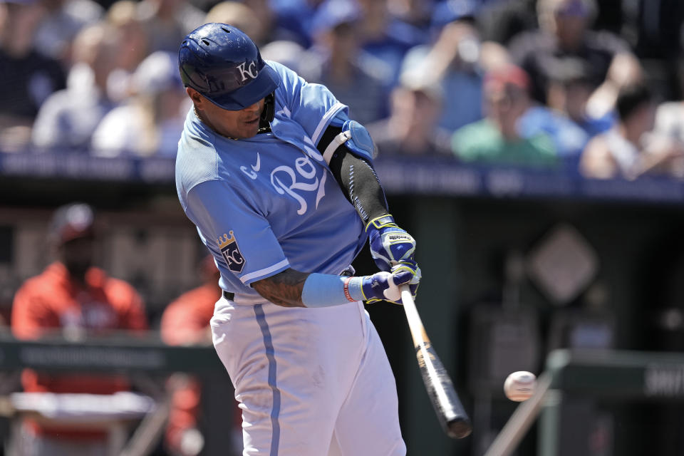 Kansas City Royals' Salvador Perez hits a solo home run during the third inning of a baseball game against the Washington Nationals Saturday, May 27, 2023, in Kansas City, Mo. (AP Photo/Charlie Riedel)