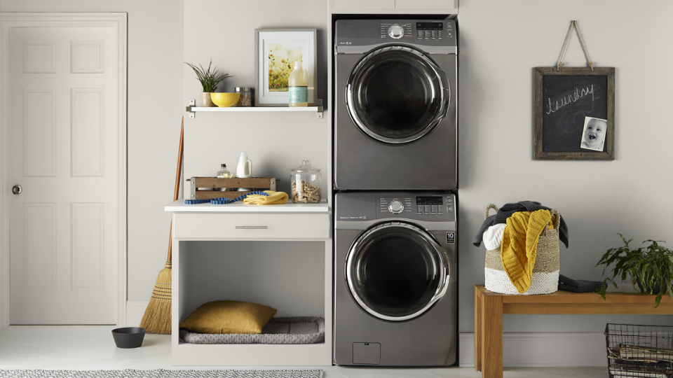 Laundry area with washers and dryers, room painted in Silver Drop by Behr.