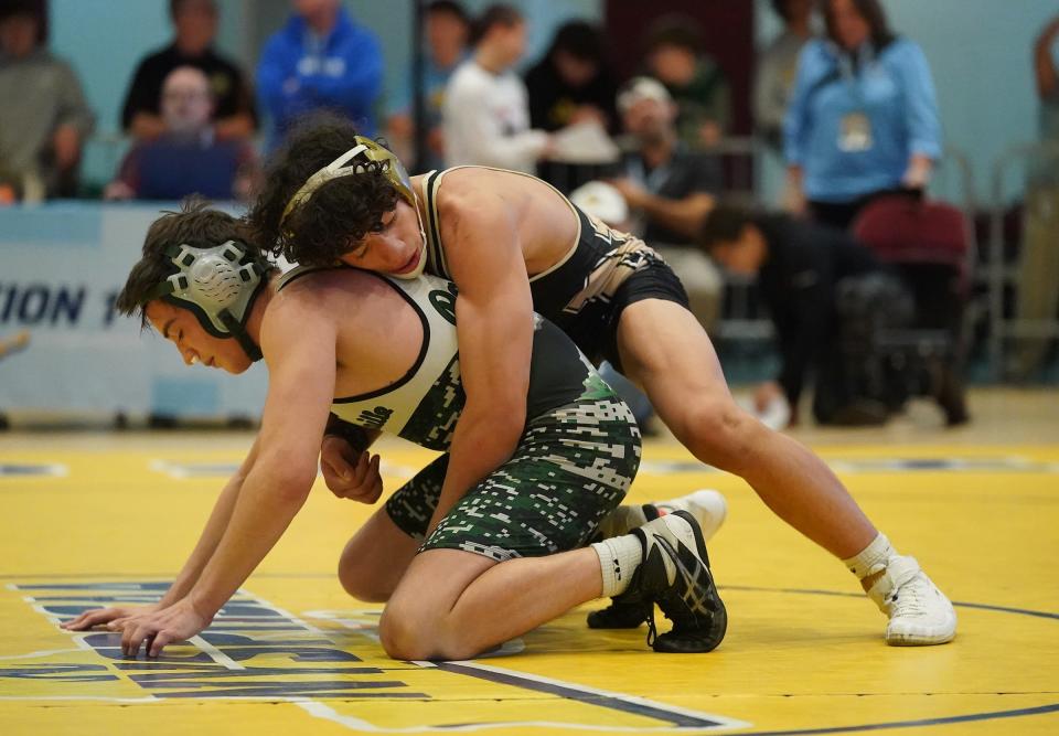 Nanuet's Ethan Badillo wrestles Pleasantville's Ciaran Egan in the 138-pound championship match at the Section 1, Division II wrestling championships at Westchester County Center on Saturday, Feb. 10, 2024.