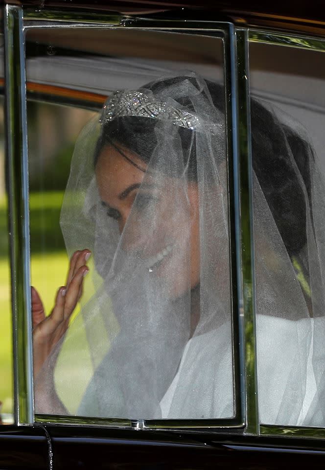 Meghan Markle in the back of the vintage Rolls-Royce (Reuters)