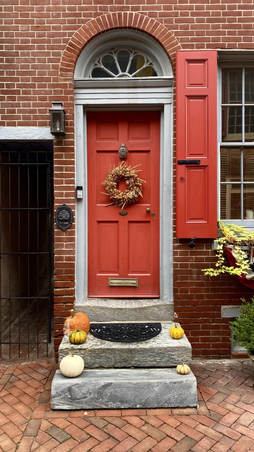 A house on Elfreth’s Alley, the nation’s oldest continually inhabited street, features a pumpkin on its stoop on Oct. 28, 2022. | Sarah Gambles, Deseret News