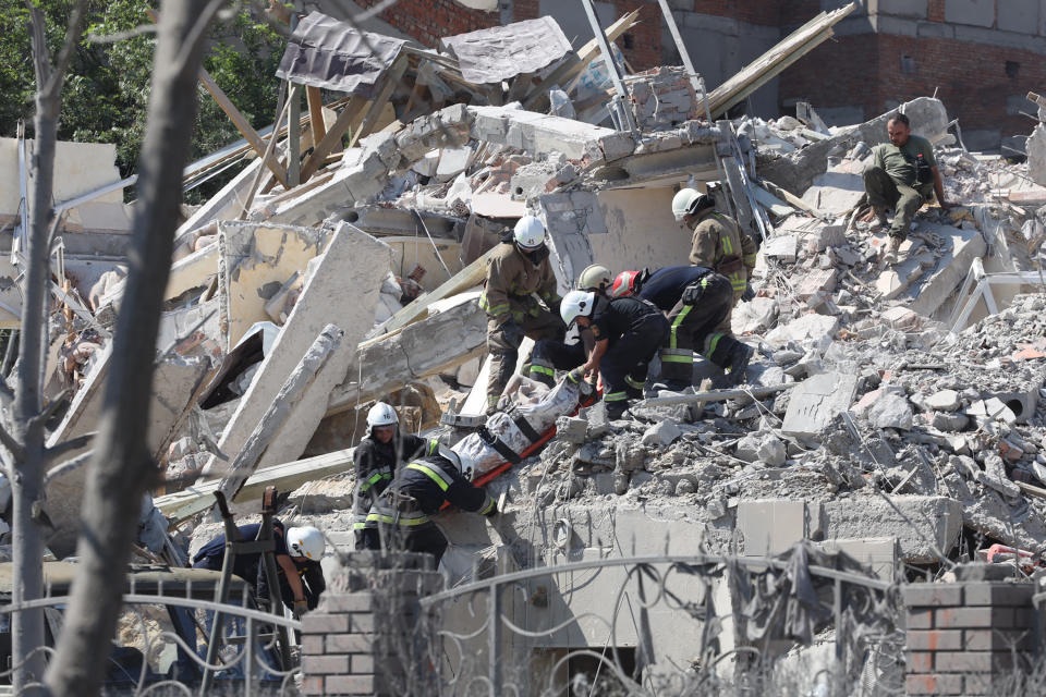 Rescuers evacuate the body of a person from a destroyed building that was hit by a missile strike in the Ukrainian town of Serhiivka, near Odesa, killing at least 20 people and injuring 30, on Friday.