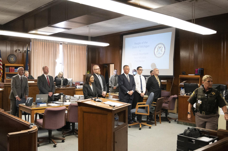 The prosecution and defense wait for the jury to enter in the courtroom of Jackson County Circuit Court Judge Thomas Wilson on Wednesday, Oct. 5, 2022 in Jackson, Mich. Paul Bellar, Joseph Morrison and Pete Musico are charged in connection with a 2020 anti-government plot to kidnap Michigan Gov. Gretchen Whitmer. (J. Scott Park/Jackson Citizen Patriot via AP, Pool)