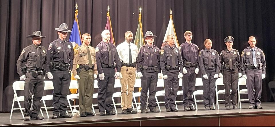 The first class of cadets to graduate from the Pennsylvania Highlands Police Academy stand at attention during the graduation ceremony.