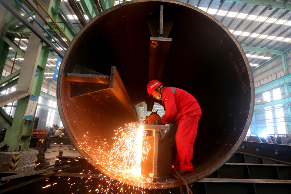A man works at a production base of China Construction Steel Structure Corp Ltd (CSCEC Steel) in Meishan, Sichuan province, China September 3, 2019. Picture taken September 3, 2019. REUTERS/Stringer  ATTENTION EDITORS - THIS IMAGE WAS PROVIDED BY A THIRD PARTY. CHINA OUT.