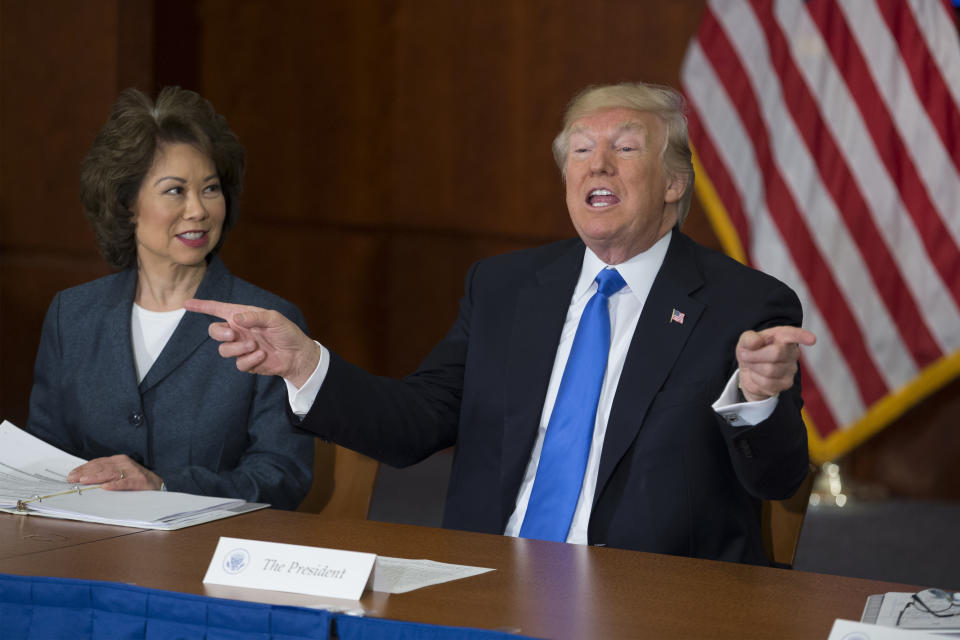 WASHINGTON, DC - JUNE 09: US President Donald Trump (R) participates in the 'Roads, Rails, and Regulatory Relief roundtable meeting', beside Secretary of Transportation Elaine Chao (L) at the Department of Transportation on June 9, 2017 in Washington, DC.  (Photo by Michael Reynolds-Pool/Getty Images)