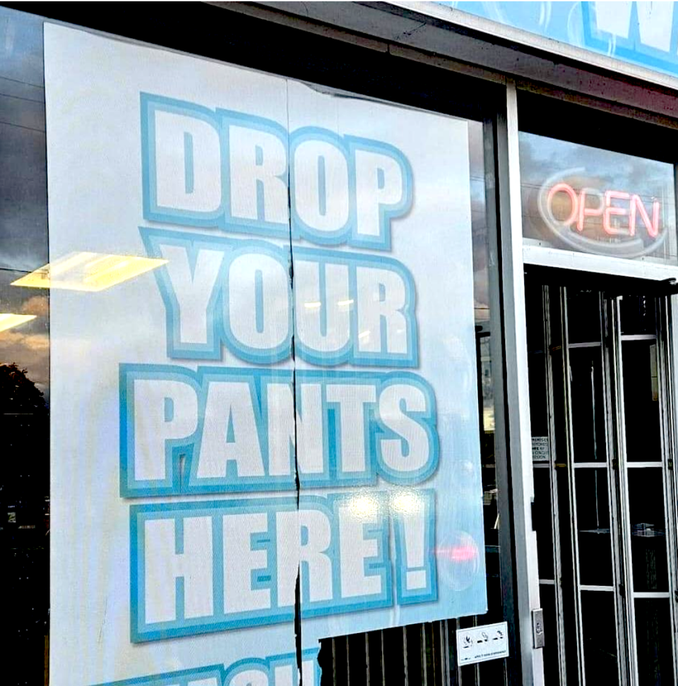 a sign that says "drop your pants here"