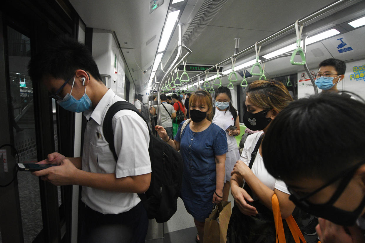 SINGAPORE, June 3, 2020 -- People take the train on the downtown line in Singapore on June 3, 2020. Singapore enters the second day of post lockdown as the state embarked on a phased reopening from a COVID-19 "circuit breaker" period to curb the spread of the coronavirus. (Photo by Then Chih Wey/Xinhua via Getty) (Xinhua/ via Getty Images)