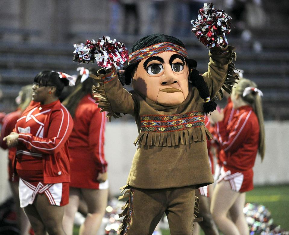 The warrior mascot for the former East High School in Erie, Pa., entertains the crowd during the game at Erie Veterans Stadium on Sept. 24, 2011.