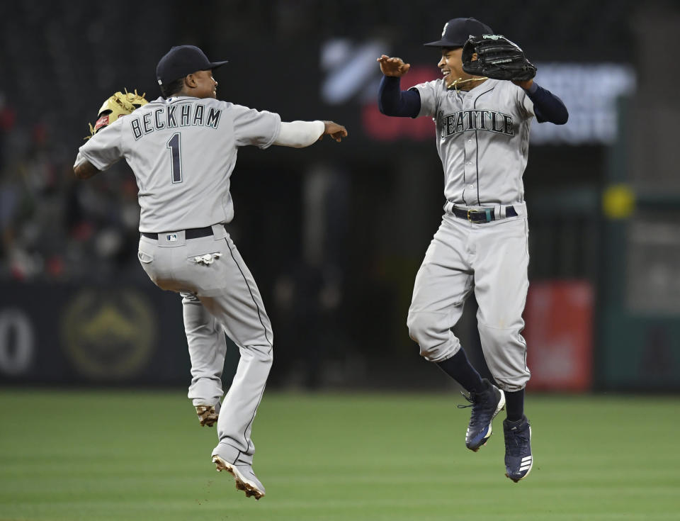 ANAHEIM, CA - APRIL 18: Tim Beckham #1 of the Seattle Mariners and Mallex Smith #0 of the Seattle Mariners celebrate the final out against Los Angeles Angels of Anaheim at Angel Stadium of Anaheim on April 18, 2019 in Anaheim, California. Mariners won 11-10. (Photo by John McCoy/Getty Images)