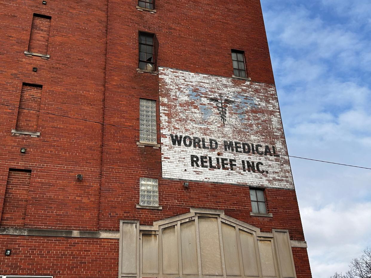 Faded ghost signs for the original World Medical Relief Inc. building still sit atop the structure now housing Cass Community Social Services at 11745 Rosa Parks Boulevard in Detroit.