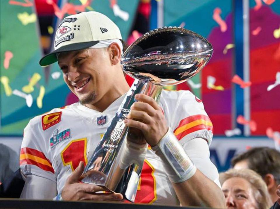 Kansas City Chiefs quarterback Patrick Mahomes hoists the Lombardi Trophy