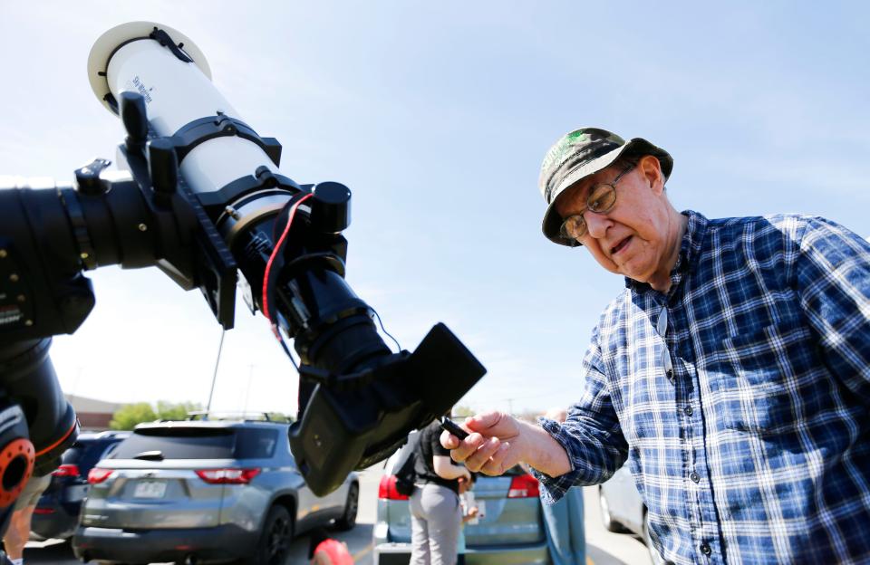 Missouri State University physics and astronomy professor Dr. Bill Thomas sets up his camera and telescope before the start of the total solar eclipse at the West Plains Civic Center on Monday, April 8, 2024.