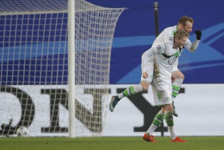 Football Soccer - CSKA Moscow v VfL Wolfsburg - Champions League Group Stage - Group B - Arena Khimki, Khimki, Russia - 25/11/15 VfL Wolfsburg's Andre Schuerrle celebrates with his team mate Maximilian Arnold after scoring a goal for CSKA Moscow REUTERS/Maxim Shemetov