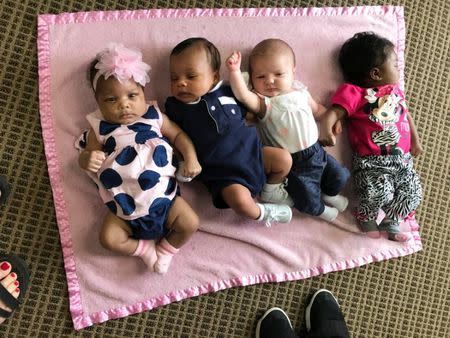 L-R: Karlee J. Scott, Thomas P. Sanders, Elizabeth Bush, and Ka’mauria J. Thomas who were born at the hospital in late April or early May are pictured together as their mothers participate in the group pregnancy session to learn from the medical staff and each other about everything from nutrition to postpartum depression in Bay Minette, Alabama, U.S. on June 22, 2017. REUTERS/Jilian Mincer