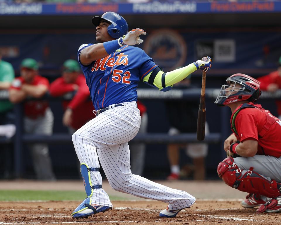 Yoenis Cespedes is back with the Mets after signing another big contract. (AP)