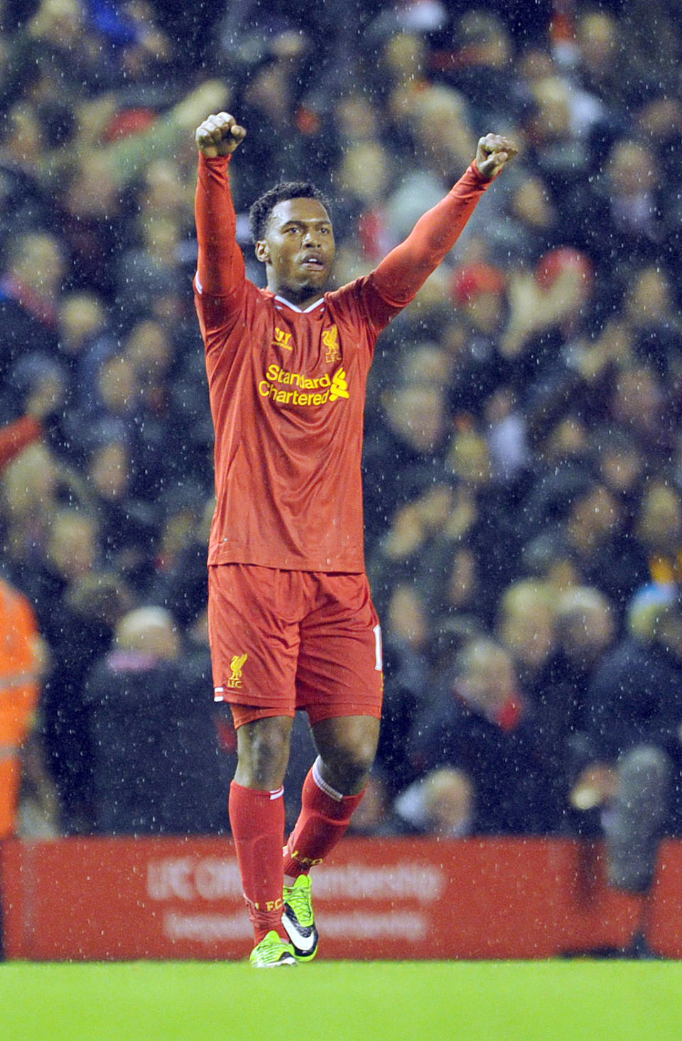 Liverpool's Daniel Sturridge celebrates after he scords the second goal of the game for his side during their English Premier League soccer match against Everton at Anfield in Liverpool, England, Tuesday Jan. 28, 2014. (AP Photo/Clint Hughes)